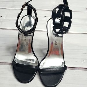 Black ankle strappy shoes.